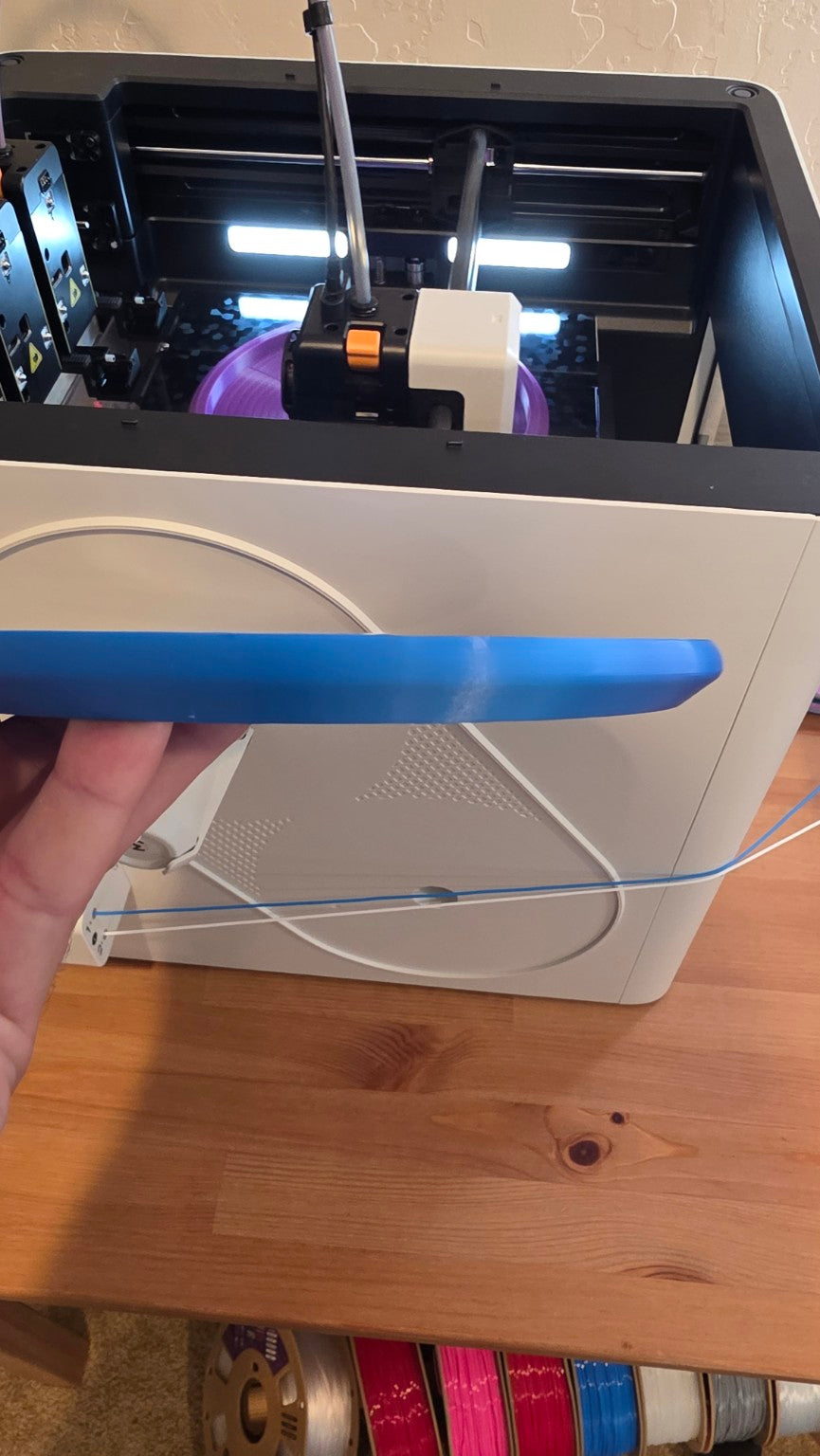 Side profile showing the V1 sharper bottom edge