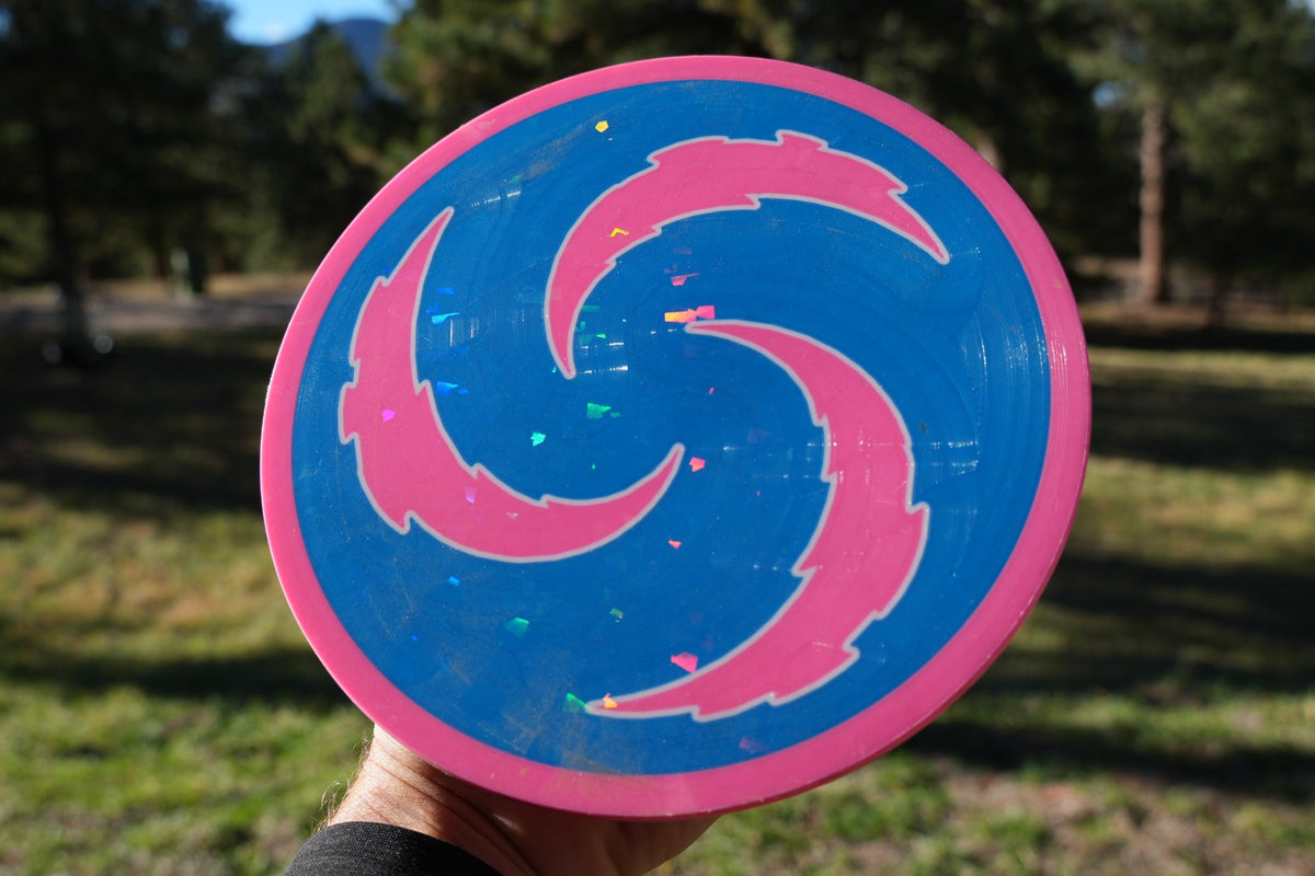CC-001 Monster Claw prototype in blue and pink photographed outdoors