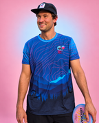 Luke wearing the Cotton Candy jersey — pink and blue studio image